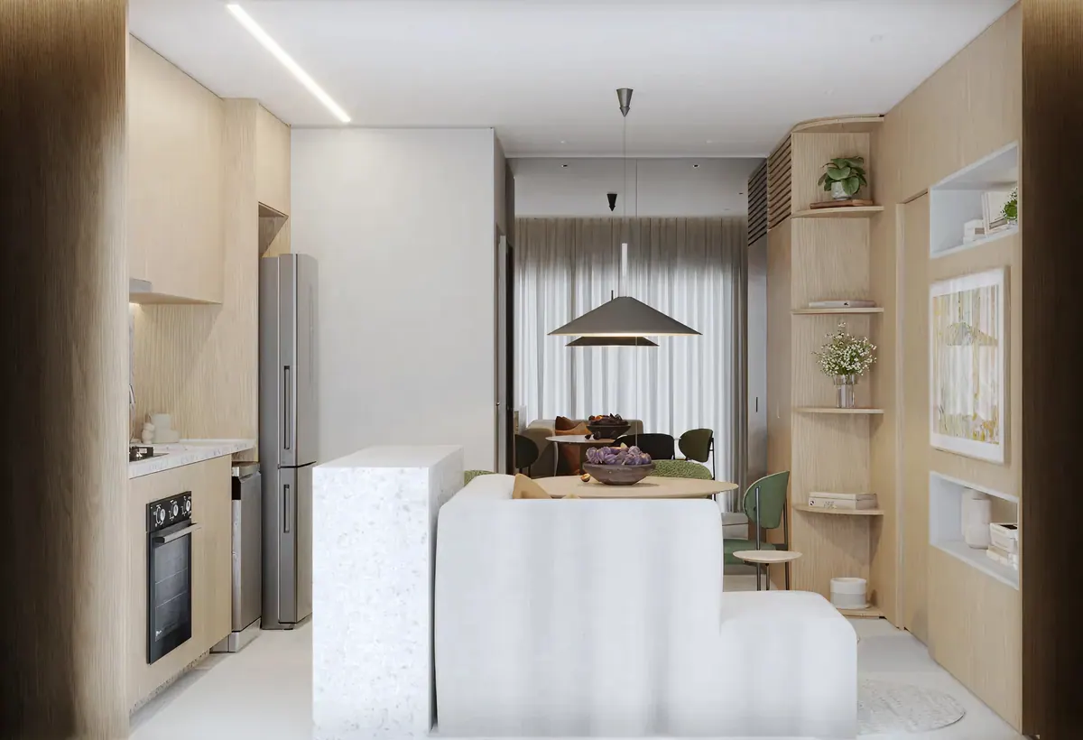 Vista da entrada: cozinha à esquerda, bancada de granilite e sala de jantar ao fundo